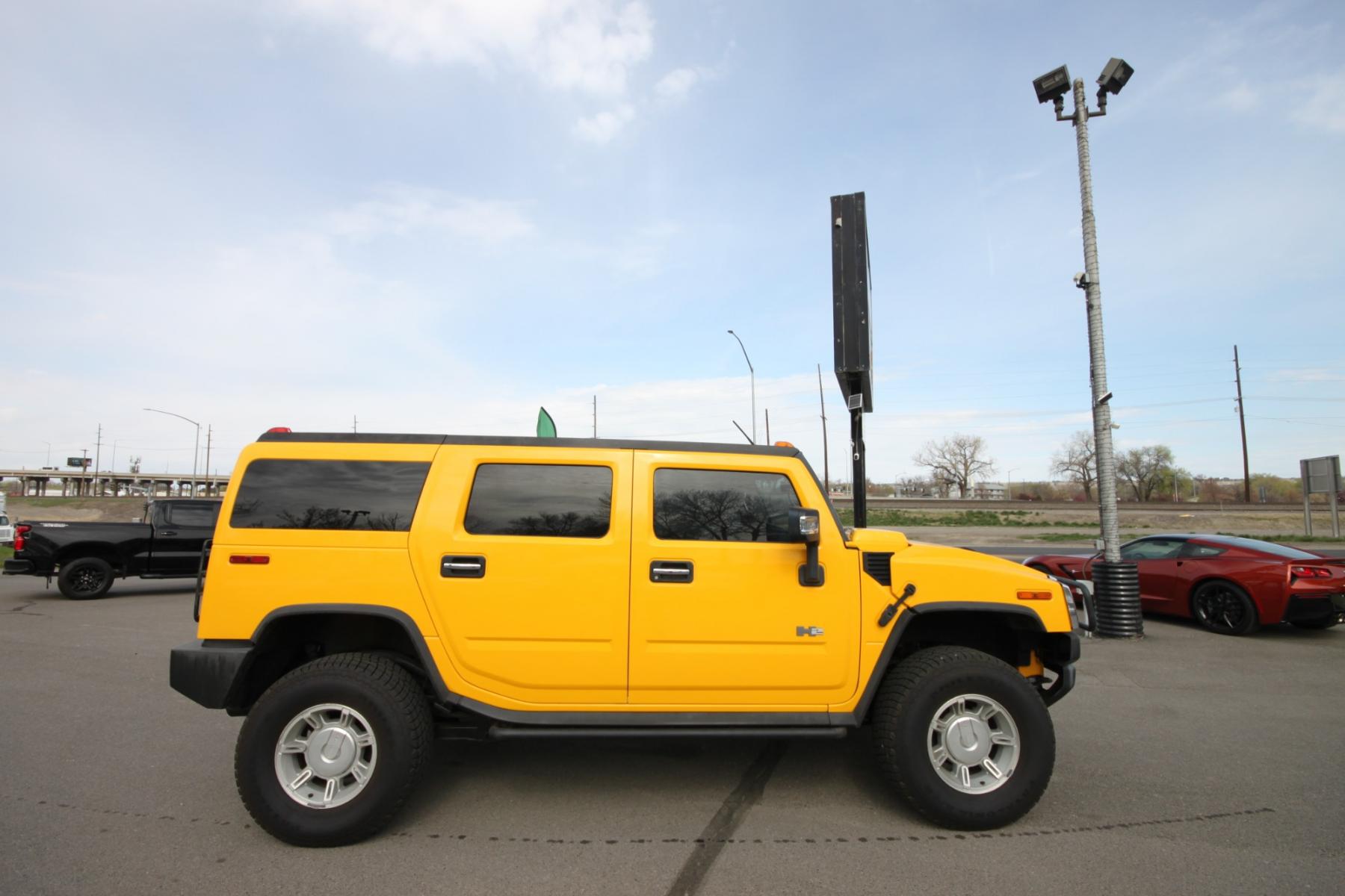 2003 Yellow /Gray Hummer H2 H2 (5GRGN23U73H) with an 6.0 Gasoline V8 engine, 4 speed automatic transmission, located at 4562 State Avenue, Billings, MT, 59101, (406) 896-9833, 45.769516, -108.526772 - 2003 Hummer H2 Sport Utility - Leather & Sunroof! 6.0 gasoline V8 engine - 4 speed heavy duty automatic transmission - 4WD - 106,898 miles Dual zone climate control - air conditioning - tilt steering wheel - cruise control - touchscreen audio (faceplate pulled at time of pictures) - power win - Photo #0